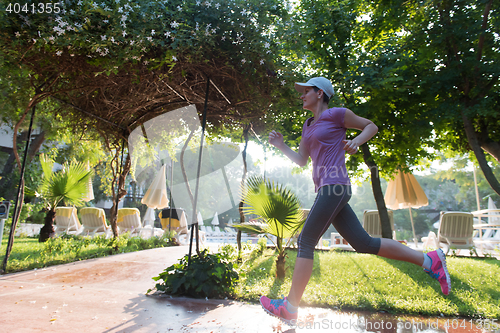 Image of sporty woman jogging