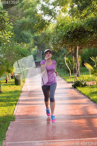Image of sporty woman jogging