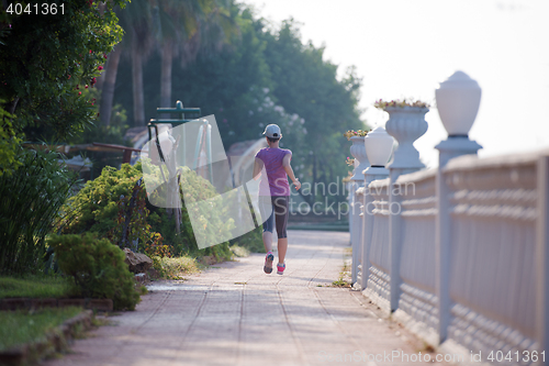 Image of sporty woman jogging