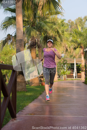 Image of sporty woman jogging