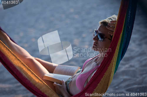 Image of relaxed woman laying in hammock