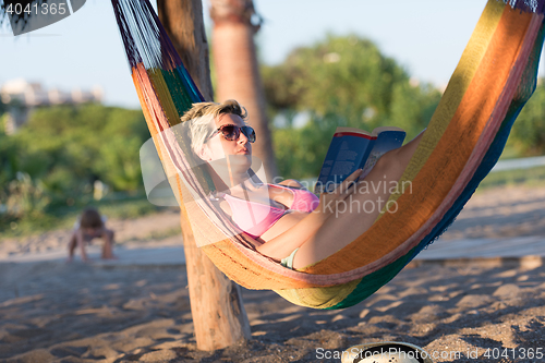 Image of relaxed woman laying in hammock