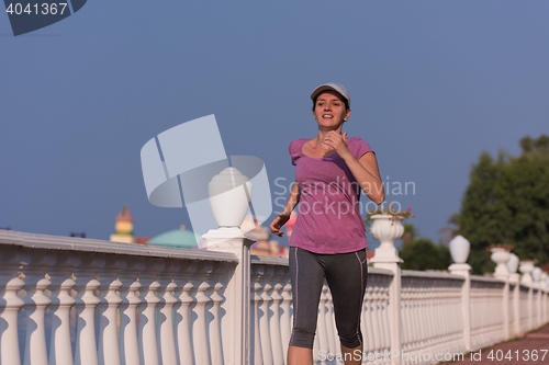 Image of sporty woman jogging