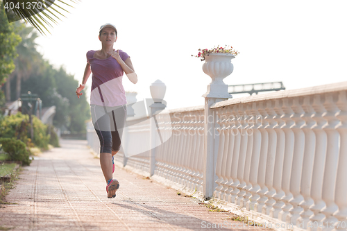 Image of sporty woman jogging