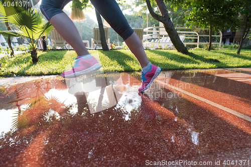 Image of sporty woman jogging