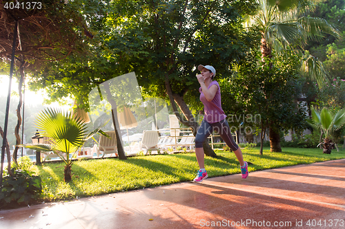 Image of sporty woman jogging