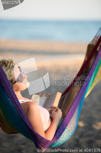 Image of relaxed woman laying in hammock