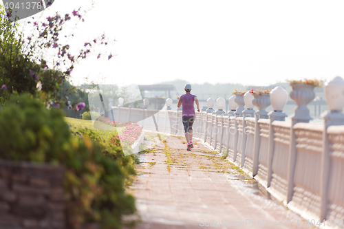 Image of sporty woman jogging