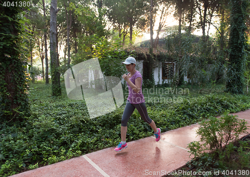 Image of sporty woman jogging