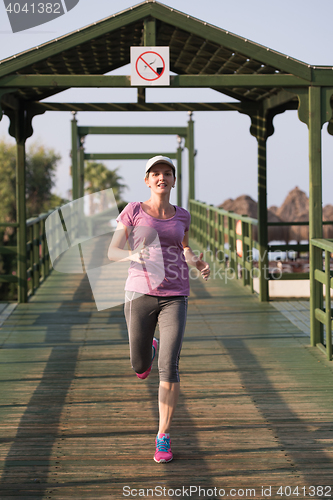 Image of sporty woman jogging