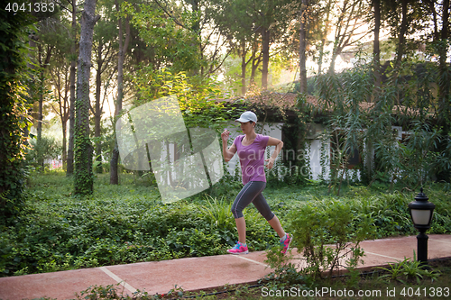 Image of sporty woman jogging