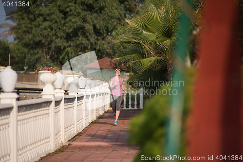 Image of sporty woman jogging