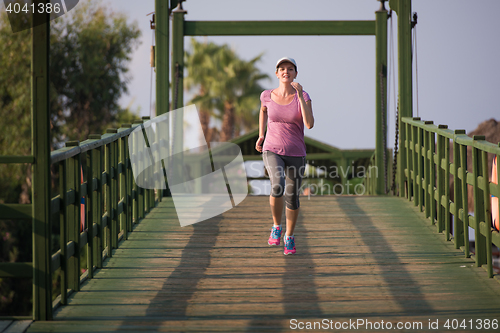 Image of sporty woman jogging