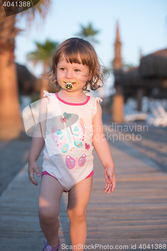 Image of girl and mother walking