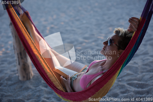 Image of relaxed woman laying in hammock