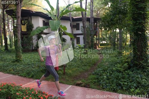 Image of sporty woman jogging