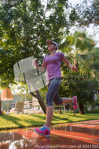 Image of sporty woman jogging