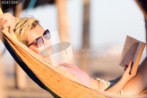 Image of relaxed woman laying in hammock