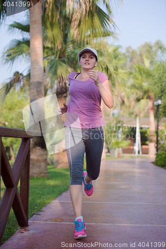 Image of sporty woman jogging