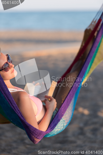 Image of relaxed woman laying in hammock