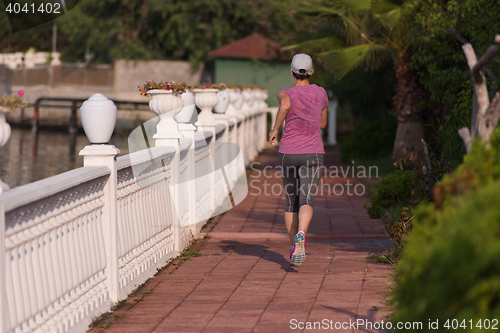 Image of sporty woman jogging