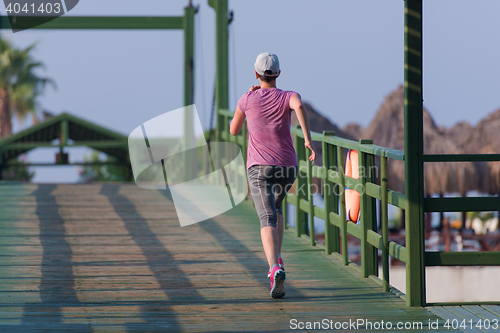 Image of sporty woman jogging