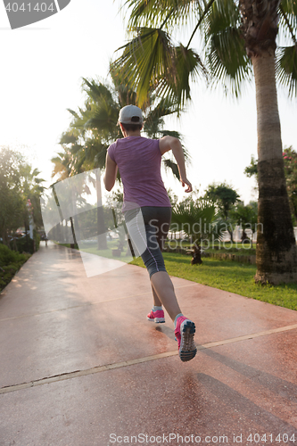 Image of sporty woman jogging