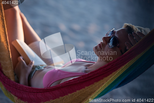 Image of relaxed woman laying in hammock