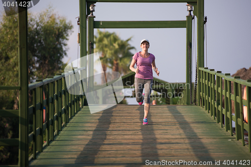 Image of sporty woman jogging