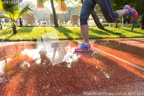 Image of sporty woman jogging