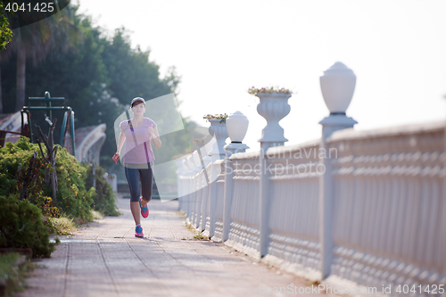 Image of sporty woman jogging