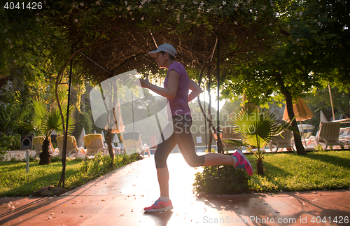 Image of sporty woman jogging