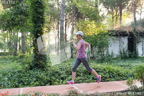 Image of sporty woman jogging