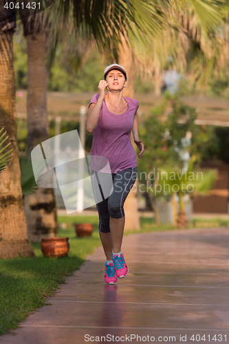 Image of sporty woman jogging
