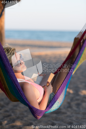 Image of relaxed woman laying in hammock