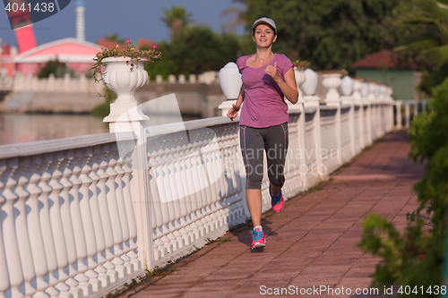 Image of sporty woman jogging