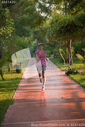 Image of sporty woman jogging