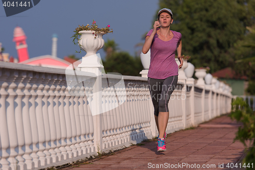 Image of sporty woman jogging