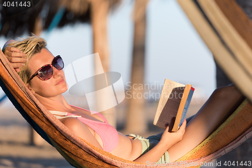 Image of relaxed woman laying in hammock