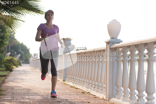 Image of sporty woman jogging