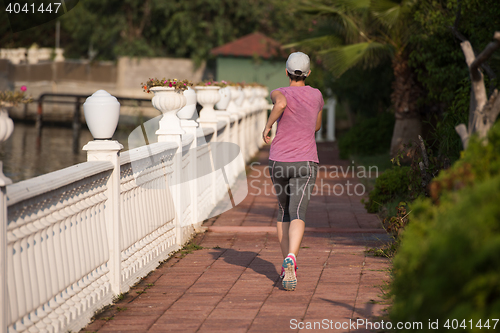 Image of sporty woman jogging