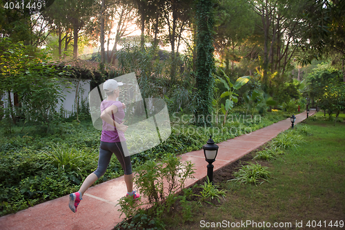 Image of sporty woman jogging