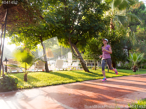 Image of sporty woman jogging