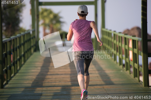 Image of sporty woman jogging