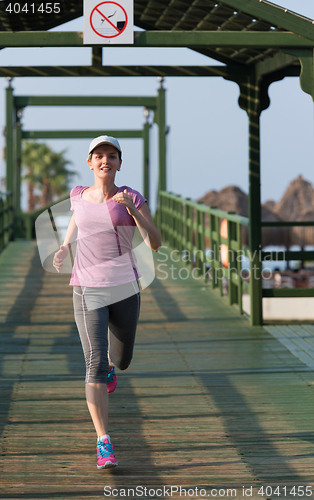 Image of sporty woman jogging