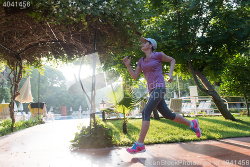 Image of sporty woman jogging