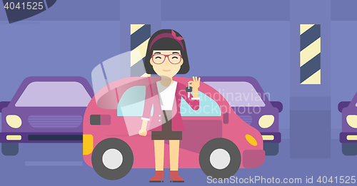 Image of Woman holding keys to her new car.