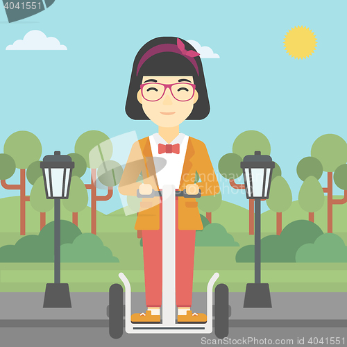 Image of Woman driving electric scooter.