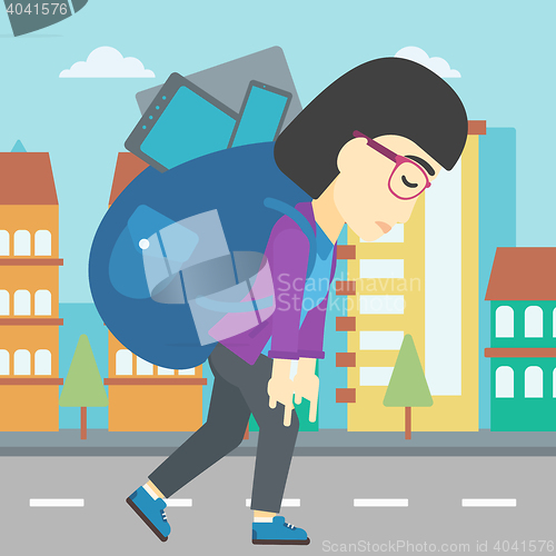 Image of Woman with backpack full of electronic devices.