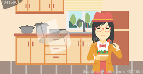 Image of Woman eating healthy vegetable salad.